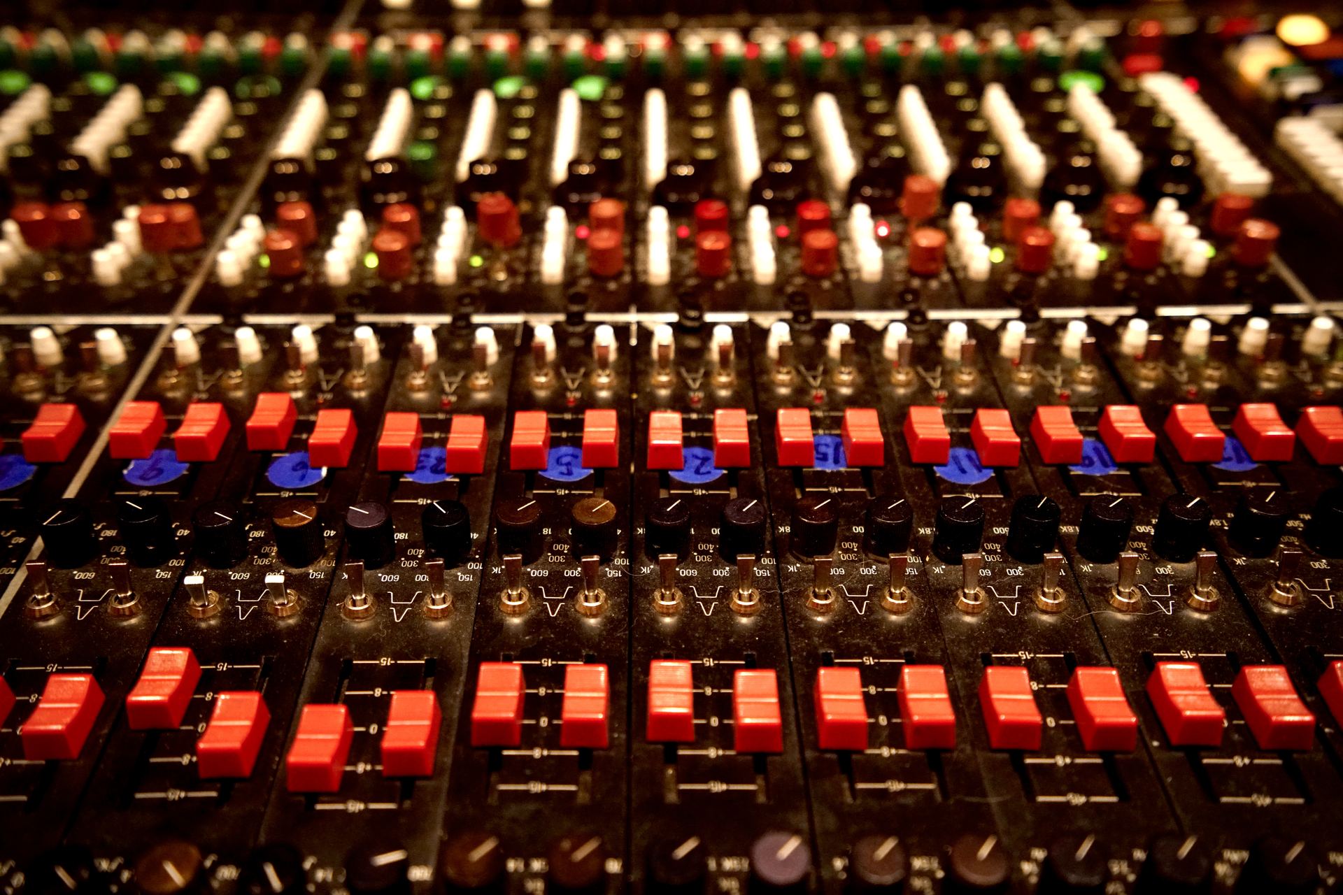 Trident TSM 40 channel strip detail — red EQ buttons, faders